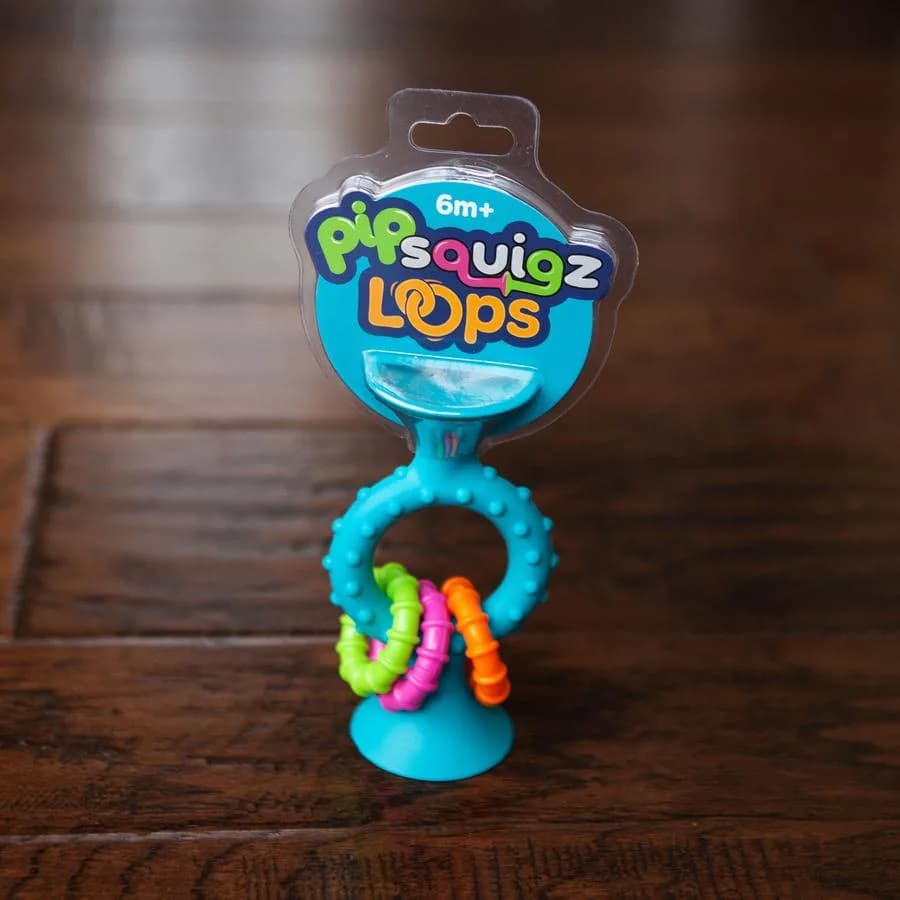 Брязкальце-прорізувач Fat Brain Toys pipSquigz Loops F166ML фото 4 Брязкальце-прорізувач Fat Brain Toys pipSquigz Loops F166ML фото 4