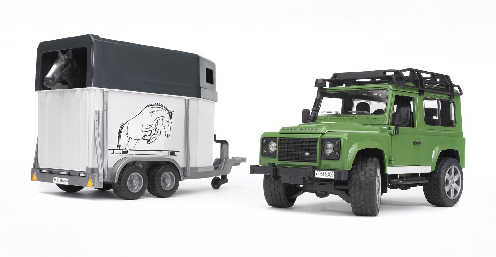 Позашляховик Land Rover Defender з трейлером для перевезення коней та кінь 1:16 Bruder 02592